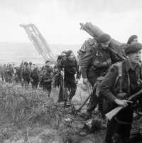 Royal_Marine_Commandos_attached_to_3rd_Division_move_inland_from_Sword_Beach_on_the_Normandy_c...jpg