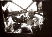 2nd Lieutenant Everett Glen Hanes poses for a picture with his Norden Bombsight in the nose of h.jpg