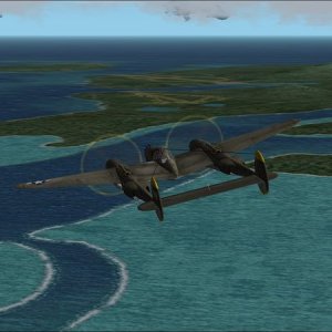 Russell Islands: Flying south-east past east end of Pavuvu Is. with Sunlight and Renard fields in distance.